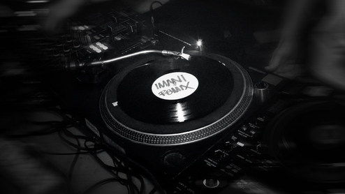 Black-and-white close-up of dubplate reading Imani Remix