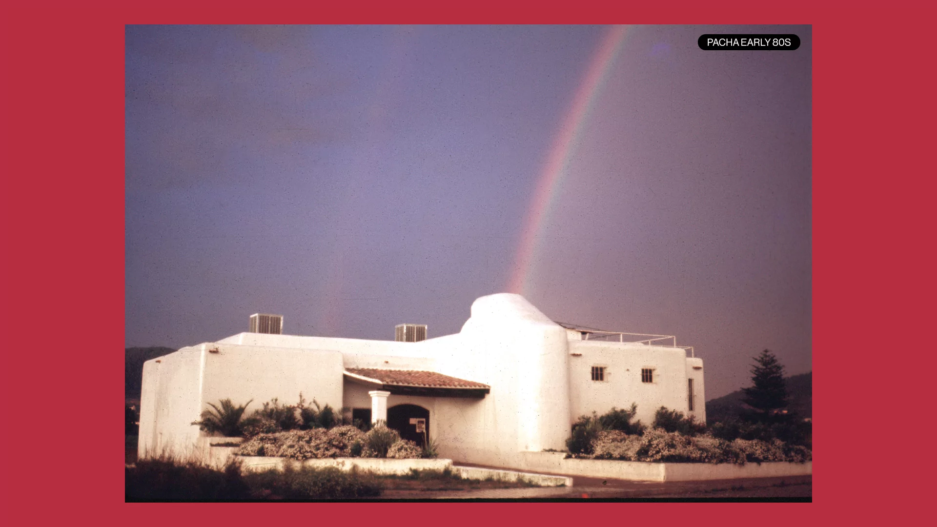 Photo of the Pacha Ibiza building early 1980s with a rainbow above it